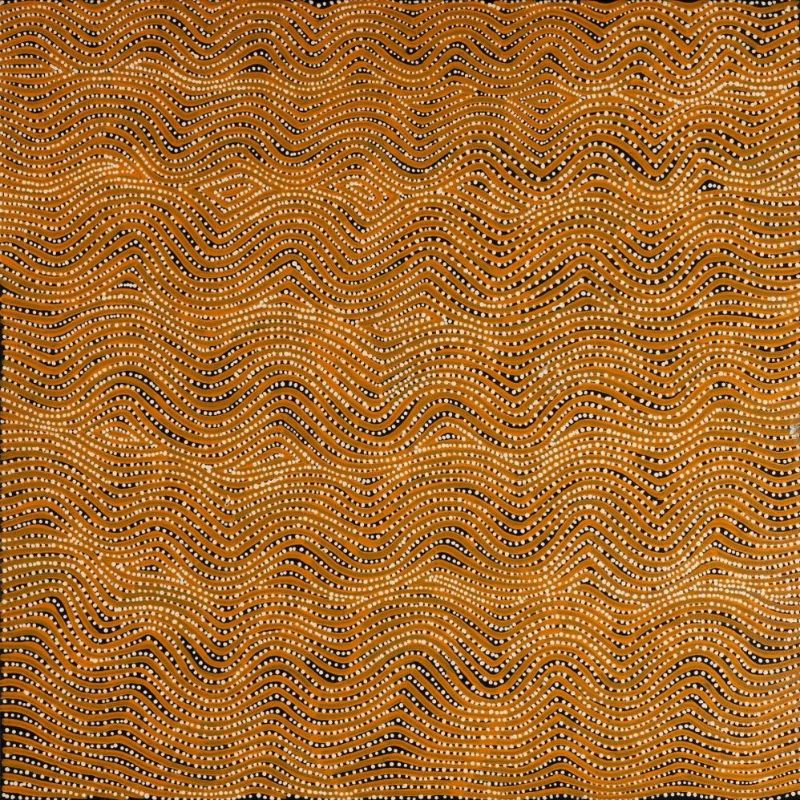 Marrawa by Warlimpirrnga Tjapaltjarri, 2004. A square painting in warm golden ochre, burnt orange, black and white. Hundreds of gently undulating horizontal bands sweep across the canvas like waves. Each band is formed from rows of tiny white and ochre dots separated by thin black lines, creating a shimmering optical effect. Small diamond-shaped motifs appear intermittently within the flowing pattern, evoking rippling sand dunes, moving water and the vast landscape of the Western Desert.