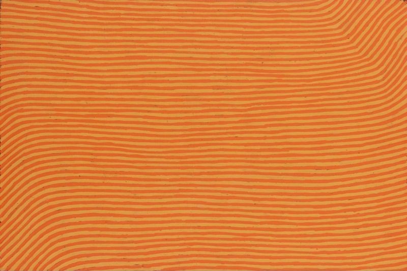 George Tjungurrayi Tingari 2000 Papunya Tula painting with fine reddish-orange parallel lines flowing across a golden ochre background