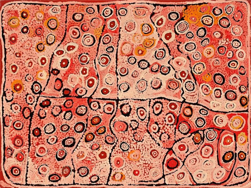 Naata Nungurrayi painting Karrinwarra (2003), featuring interconnected fields of concentric ceremonial motifs in soft pink, cream, terracotta and ochre representing the Karrinwarra rockholes in Pintupi Country.