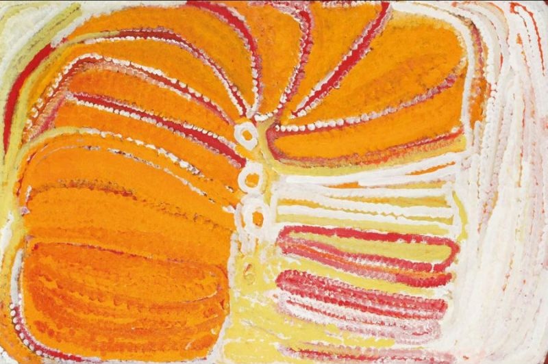 Kinyu by Eubena Nampitjin depicting sweeping orange, ochre, cream and white sandhills radiating from three central rockholes, painted in a bold gestural Balgo style.