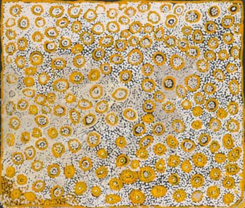 Naata Nungurrayi painting Untitled (2004), featuring hundreds of concentric yellow and ochre ceremonial motifs scattered across a finely dotted white ground in a luminous Western Desert composition.