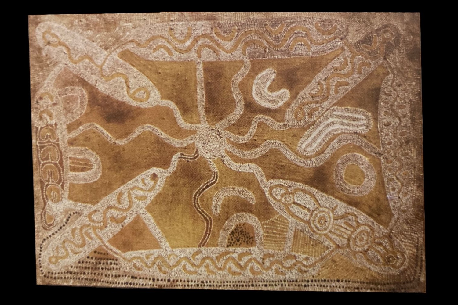 Early Papunya Board by Tommy Lowry Tjapaltjarri featuring interconnected ancestral pathways, ceremonial sites and flowing linear designs in ochre and white.