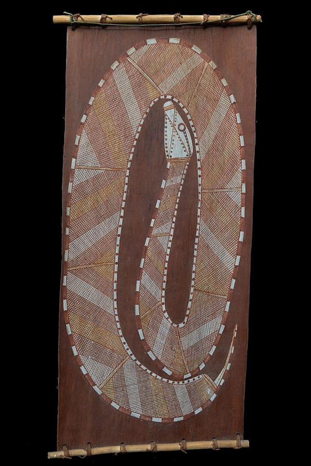 David Milaybuma bark painting depicting a snake in natural ochres on eucalyptus bark, Western Arnhem Land.