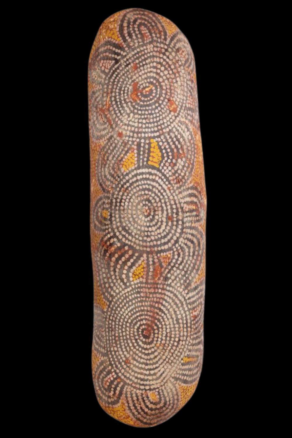 Painted coolamon by Tommy Lowry Tjapaltjarri featuring concentric circles, curved ceremonial motifs and traditional Western Desert dot designs.