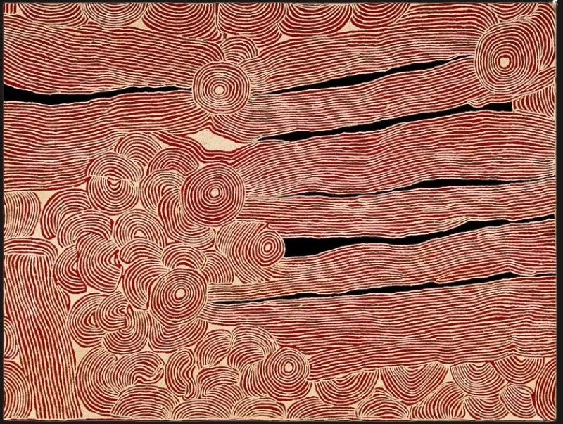 Large rectangular Aboriginal painting by Ningura Napurrula with a red-ochre ground covered in dense, fine cream-coloured parallel lines. Concentric circles appear across the composition, with a large cluster of rounded forms at lower left and long horizontal bands separated by irregular black spaces extending across the right side.