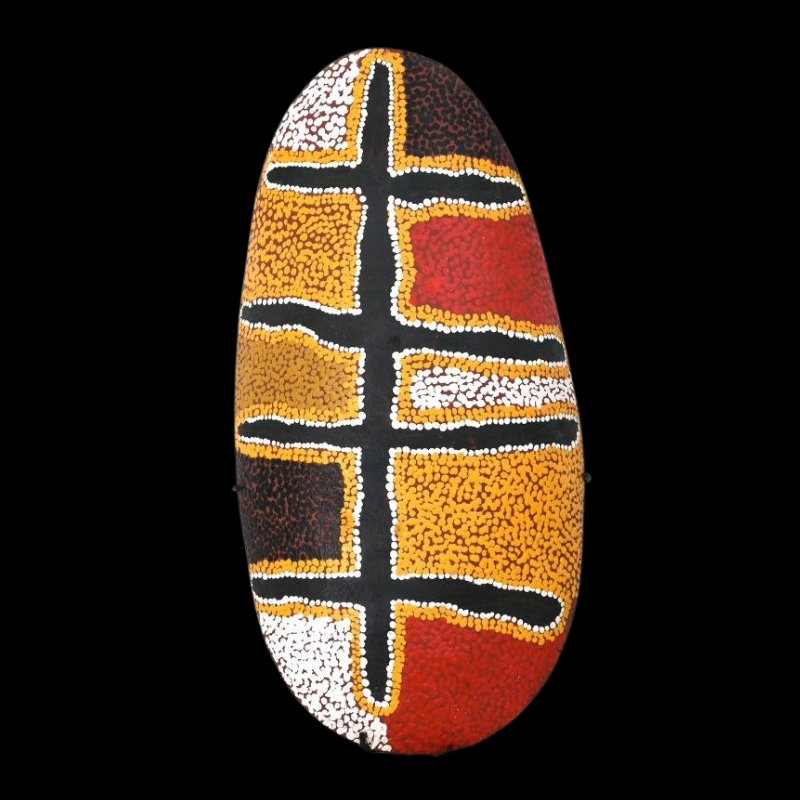 Oval carved wood coolamon painting by Sunfly Tjampitjin with branching black pathways outlined in white dots between fields of ochre, red, brown and white.