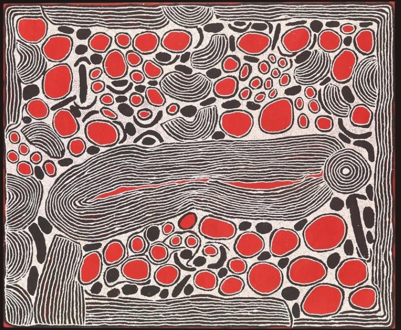 Red, black and white Aboriginal painting by Ningura Napurrula with a large elongated field of tightly packed parallel lines stretching horizontally across the centre. Bright red rounded shapes and smaller black forms cluster above and below it, while a concentric circle appears at the right and bands of fine black and white lines frame the composition.