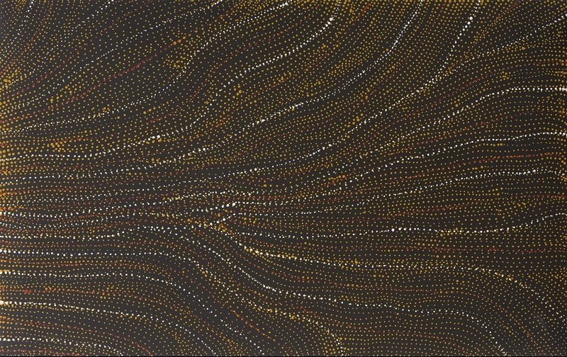 Abstract painting on a dark brown background with thousands of tiny white, yellow and pale ochre dots flowing in long, parallel, gently curving lines. The bands sweep across the canvas from multiple directions, converging near the centre to create the impression of sandhills, wind patterns and ancestral pathways viewed from above.