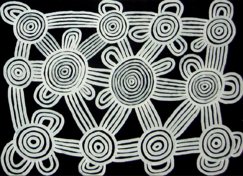 Ronnie Tjampitjinpa’s Tingari Cycle (1995), featuring interconnected white concentric circles, parallel travelling lines and looped forms arranged across a black ground.