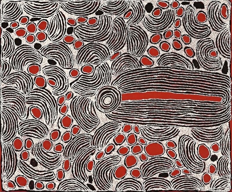 Red, black and white Aboriginal painting by Ningura Napurrula densely filled with overlapping curved bands of fine white lines and clusters of bright red oval forms. A large elongated shape dominates the right centre, formed from tightly spaced black and white lines surrounding a long red interior and joined at its left end to a concentric circle