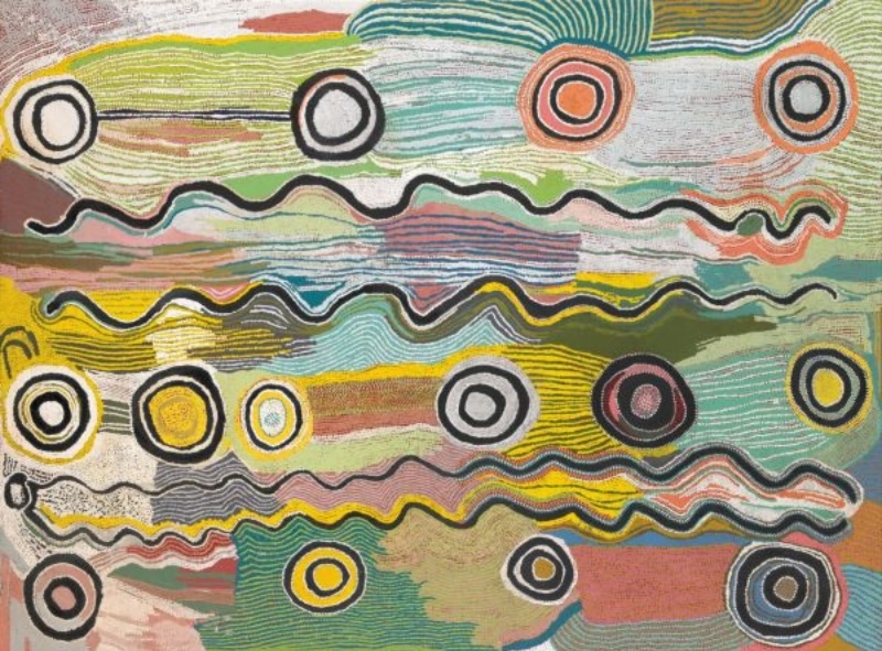 Maggie Watson Napangardi painting with numerous black-outlined concentric circles and long undulating lines crossing fields of pale green, yellow, pink, blue, orange and white.