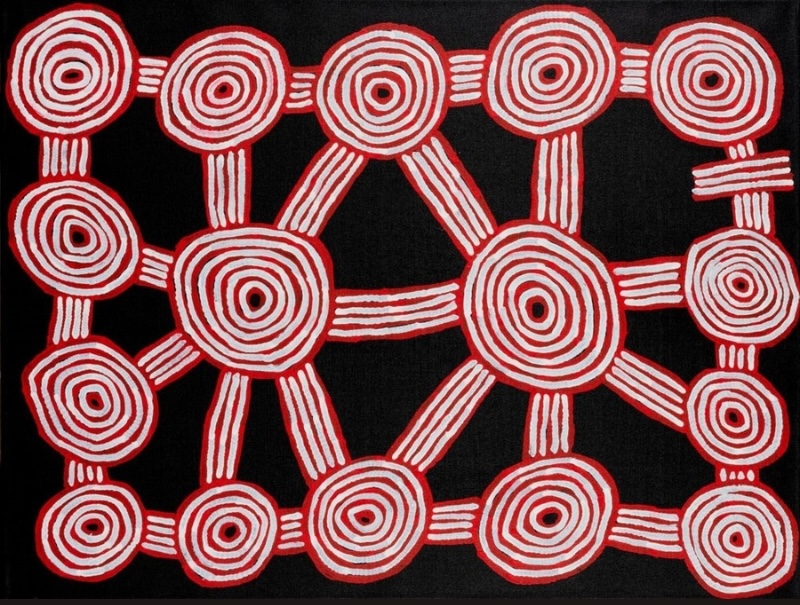 Ronnie Tjampitjinpa Tingari Cycle 2001 painting, with red and white concentric circles connected by parallel lines across a black ground.