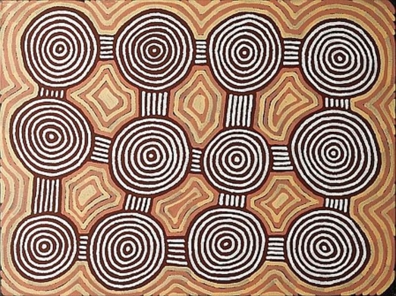 Ronnie Tjampitjinpa Rockhole Site of Pukulnya 1998 painting, with twelve concentric circular motifs linked by white parallel lines against a red ochre, cream and brown patterned ground