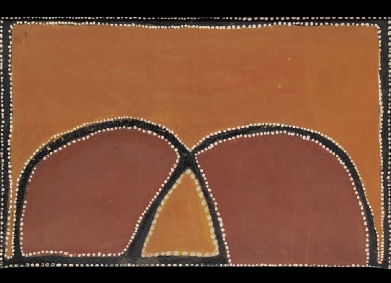 Rover Thomas painting with two large rounded red-brown forms rising from the bottom of an orange ochre field. Thick black curved bands edged with small white dots outline the forms and meet near the centre, enclosing a small triangular area of golden ochre. Black and white dotted lines frame the canvas.