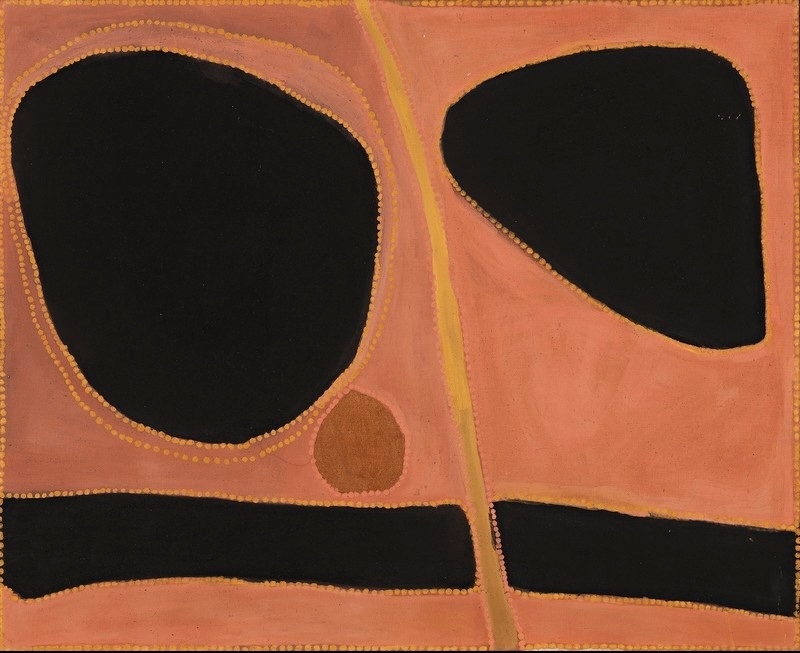 Rover Thomas painting in salmon pink, orange, brown and black ochre. Two large irregular black shapes dominate the upper half, with the larger rounded form on the left outlined by orange dots. A small brown circle sits below it, while two long black bands cross the lower canvas and a narrow yellow-orange line runs vertically between the two sides.