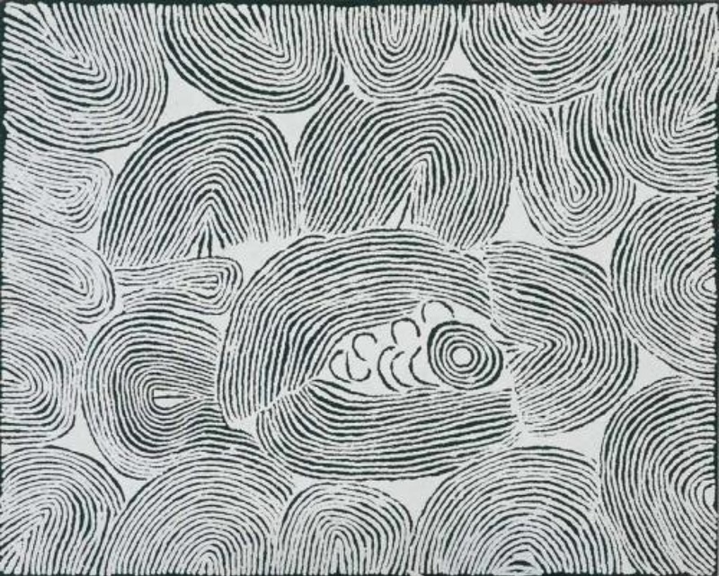Black and white Aboriginal painting by Ningura Napurrula covered with dense, closely spaced curved lines forming large concentric, arch-like and rounded shapes. Near the centre, a circular rockhole motif is surrounded by several U-shaped forms, while sweeping bands of lines flow around them across the canvas.