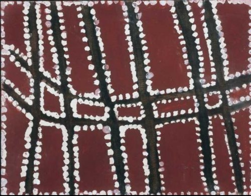 Rover Thomas ochre painting with thick black branching lines dividing a red ground into irregular rectangular areas, each bordered by bold white dots.