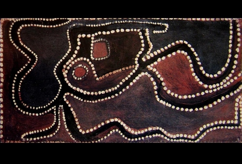 Rover Thomas ochre painting with winding black and dark brown forms, red enclosed shapes and pathways outlined by rows of white dots.