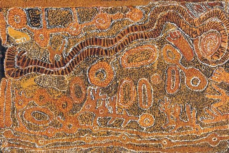 Wimmitji Tjapangarti's Untitled, 1989, with dense ochre and white dotting, winding bands, circular sites and elongated forms across a richly patterned composition.