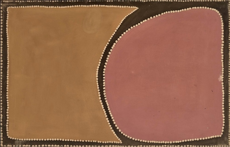 Rover Thomas painting divided into two large areas of flat earth colour. A broad mustard-brown field fills the left side and a rounded dusty pink shape fills the right, separated by a curving black band edged with rows of white dots. A dark brown border and white dots frame the entire painting.