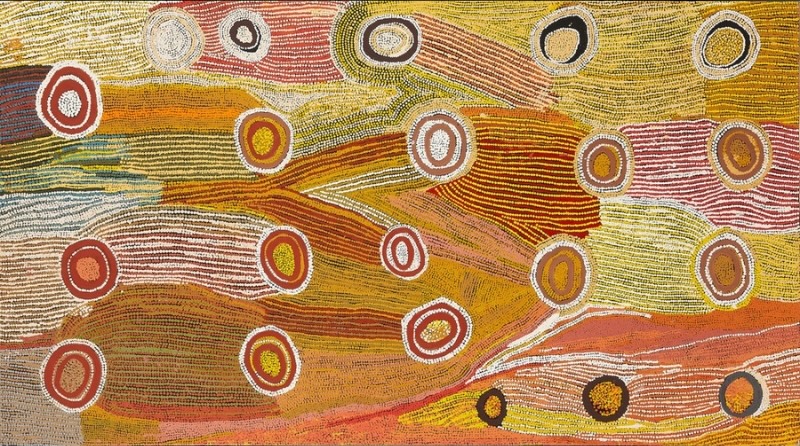 Maggie Watson Napangardi painting with numerous red, ochre, black and white concentric circles scattered across flowing fields of fine yellow, orange, pink, green and white lines.