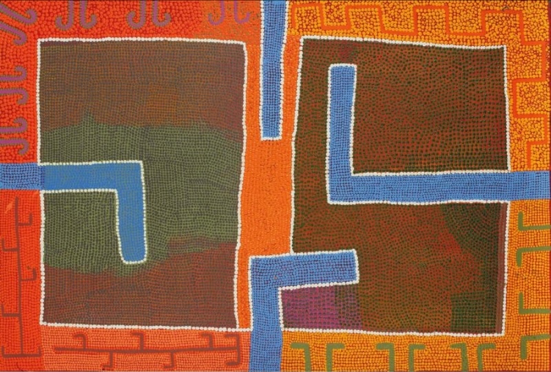 Boxer Milner’s Purkitji (2005), showing two large dark rectangular fields crossed by angular blue channels and surrounded by orange, red and yellow dotted patterns.