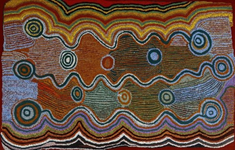 Maggie Watson Napangardi painting with broad undulating bands of fine multicoloured dots linking circular sites across a rectangular composition, representing ancestral women's travels through Country.