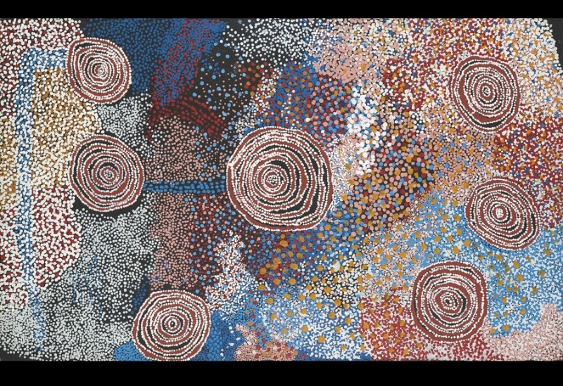 Rockholes Near the Olgas 2006 by Bill Whiskey Tjapaltjarri, showing concentric rockholes within densely dotted ancestral Country near Kata Tjuta.