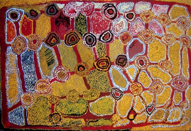 Wimmitji Tjapangarti's Untitled (Tingari Story), 1992, with circular sites linked by red pathways through irregular fields of yellow, pink, blue, green, black and white dotting.
