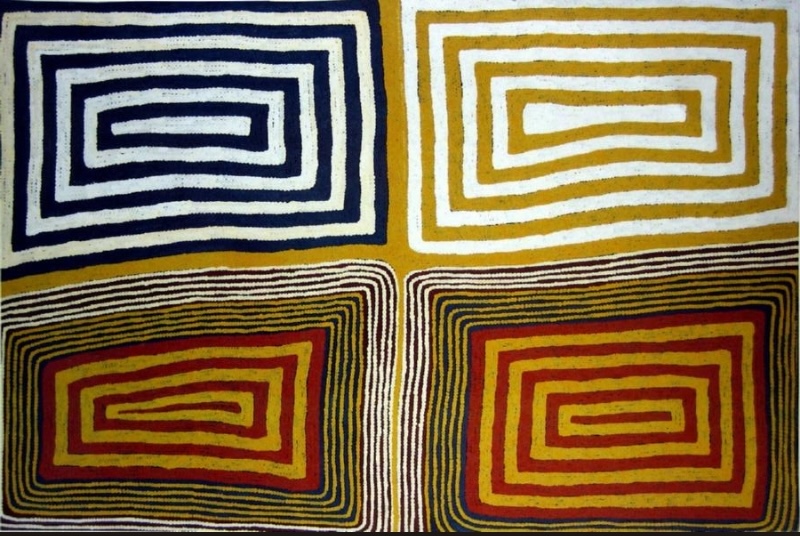 Ronnie Tjampitjinpa’s Untitled Tingari Painting (1989), divided into four large rectangular fields filled with nested linear forms in black, white, yellow, red and ochre.