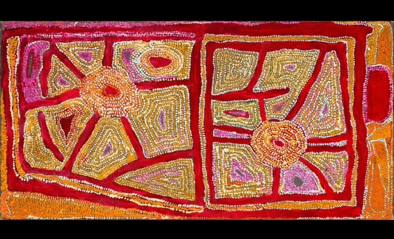 Wimmitji Tjapangarti's Untitled, 1992, showing two large circular sites connected to geometric compartments and pathways, densely dotted in red, yellow, orange, pink, white and earthy tones.