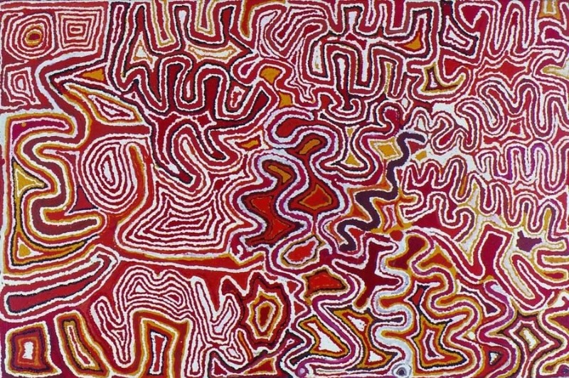 Tjumpo Tjapanangka Wiringurru Painting 1998, with dense winding white lines enclosing irregular red, ochre, black and yellow forms across the canvas.