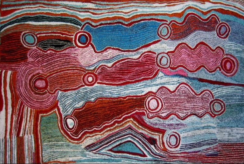 Maggie Watson Napangardi painting with elongated red and pink undulating forms connecting circular motifs, surrounded by flowing fields of blue, white, red and green lines.