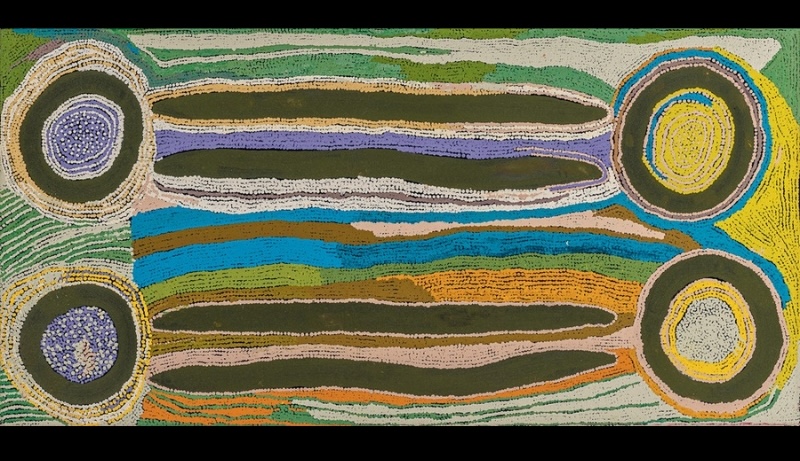 Maggie Watson Napangardi painting with four large concentric circles connected by long dark digging-stick forms, surrounded by flowing bands of green, blue, yellow, orange, purple and white dots.