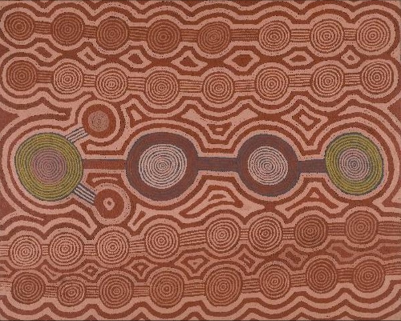Ronnie Tjampitjinpa’s Porcupine Dreaming (1988), with rows of concentric circles joined by parallel lines and surrounded by angular geometric pathways in earthy pink, brown, ochre and green tones.