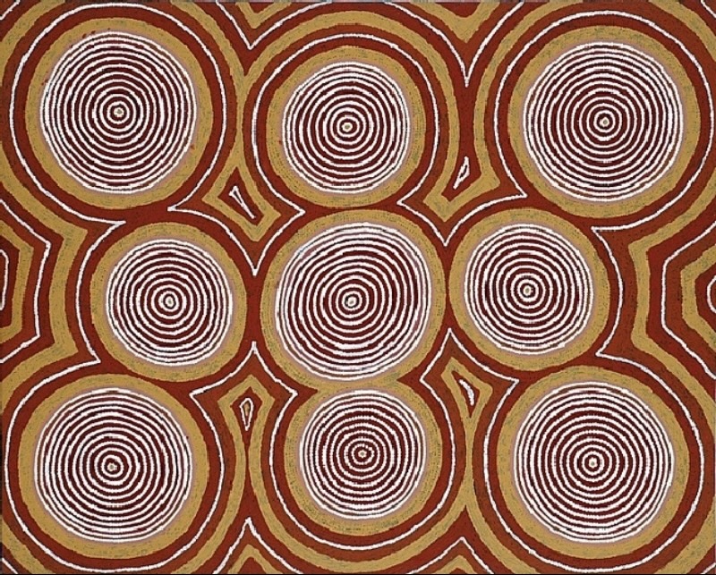 Turkey Tolson Tjupurrula Untitled (Two Mythological Tingari Women), 1990. Aboriginal painting with nine large concentric circles arranged in a grid and linked by angular ochre and red pathways on a dotted background.