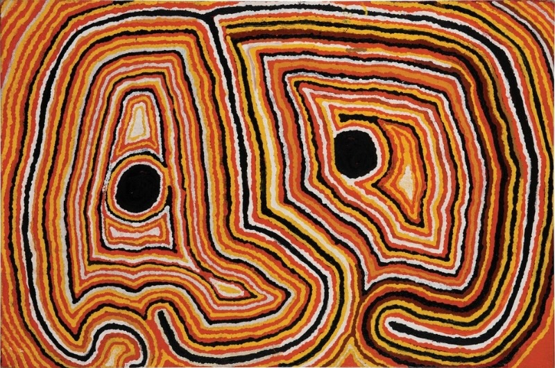 Tjumpo Tjapanangka Maruwa 1998, with two large geometric forms and black circular centres surrounded by flowing bands of red, yellow, white, black and ochre.