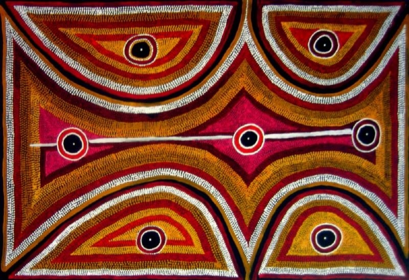 Boxer Milner’s Rainbow Dreaming Near Purwirr (Sturt Creek) (1999), with seven circular waterhole motifs surrounded by sweeping bands of red, ochre, yellow, white and black dots.