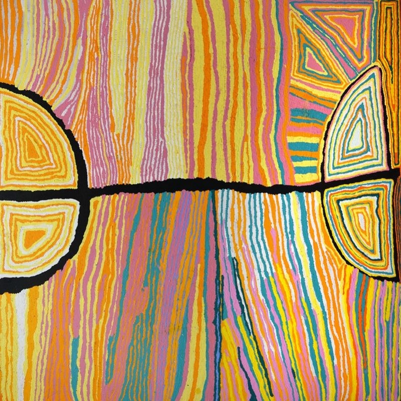 Aboriginal painting by Judy Napangardi Watson with dense vertical bands of yellow, orange, pink, green and blue crossed by a strong black horizontal line connecting large semicircular forms filled with concentric geometric designs.