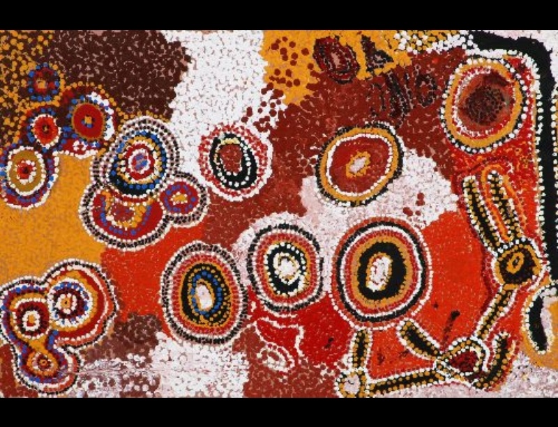 Wimmitji Tjapangarti's Kunkutjarra Near Yakka Yakka in the Great Sandy Desert, 1995, with concentric circular forms and linked motifs across broad fields of red, orange, brown and white.