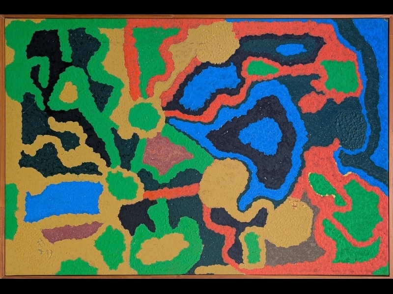 Wimmitji Tjapangarti's Inulputja, near Jupiter Well, 1993, with interlocking areas of vivid blue, green, red, yellow and black forming an abstract map-like depiction of Country.