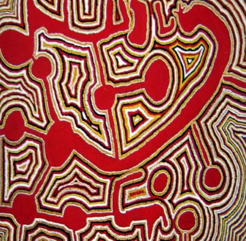 Tjumpo Tjapanangka Bandicoot Dreaming 1988, with bold red fields surrounded by winding black, white and ochre lines, circular forms and geometric shapes.
