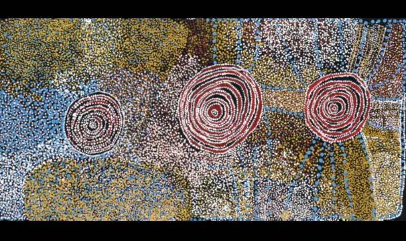 Rockholes Near Ayers Rock 2006 by Bill Whiskey Tjapaltjarri, showing three concentric rockholes surrounded by densely dotted ancestral Country.