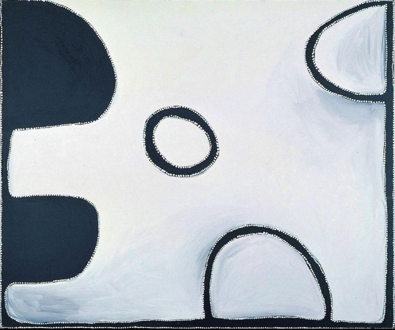 Minimalist Aboriginal painting on a pale cream background with several bold black abstract forms positioned around the edges. A large black shape rises along the left side, a rounded black form sits near the bottom centre, and a small black ring floats in the middle. Another black-edged shape occupies the upper right corner. Fine white dots outline every form and the outer border, creating a spacious composition dominated by negative space.
