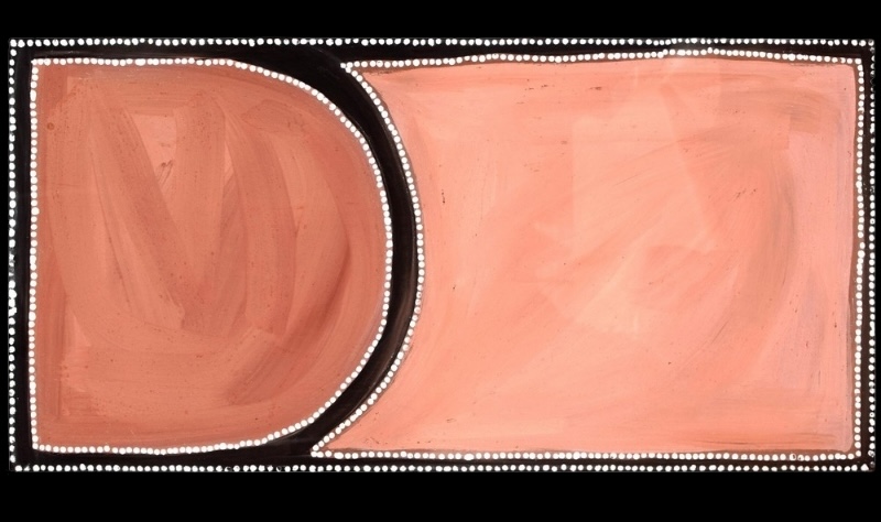 Rover Thomas ochre painting divided into two large pink and red fields by a thick curving black band, with the forms outlined by rows of white dots.