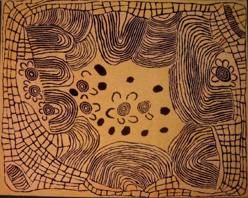 Ochre-coloured Aboriginal painting by Ningura Napurrula with dense black linear patterns forming rounded hills and grid-like shapes around the edges. The open centre contains concentric circles, U-shaped figures and scattered dark forms representing elements associated with the Wirrulnga rockhole site.