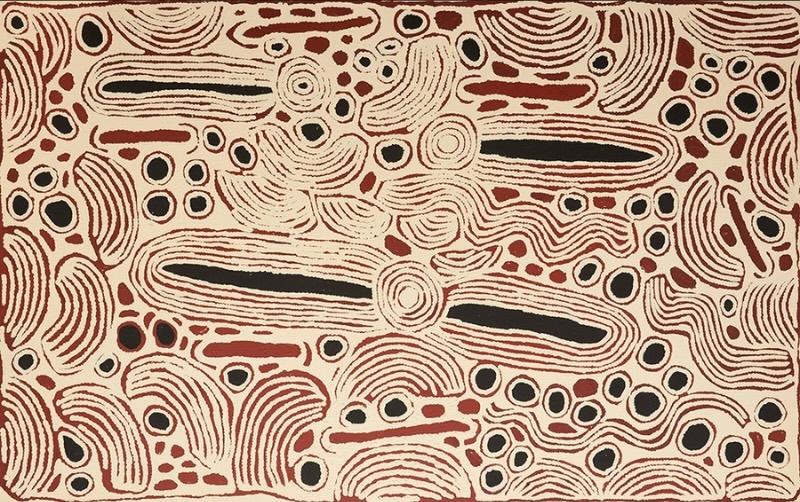 Large cream, red and black Aboriginal painting by Ningura Napurrula filled with elongated black ovals, concentric circles and clusters of smaller black and red shapes. Fine red parallel lines curve around the forms, creating semicircles, sweeping bands and irregular wave-like patterns across the canvas.