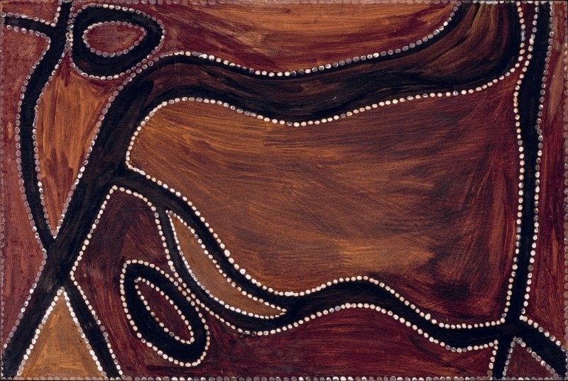 Rover Thomas ochre painting with a branching black pathway crossing broad brown and red areas, with curved and oval forms outlined by rows of white dots.
