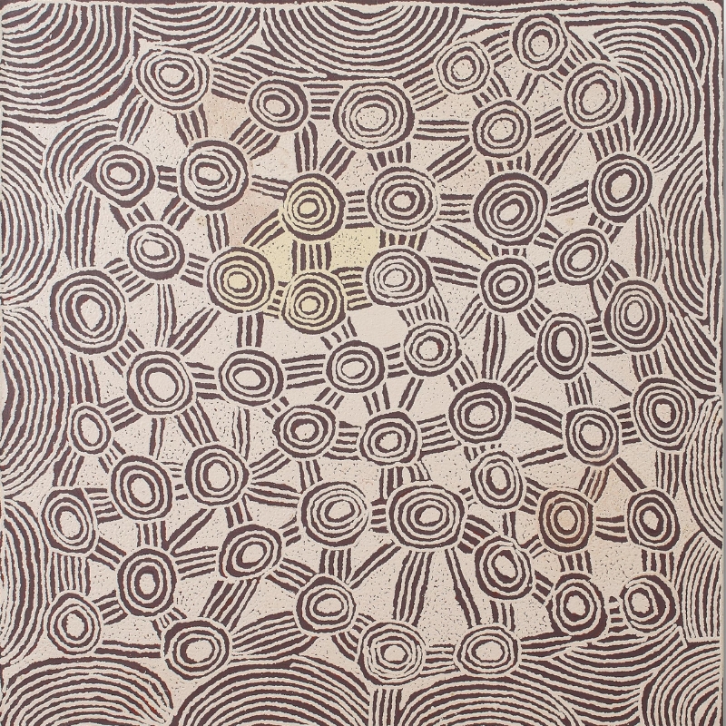 Square ochre, brown and white Aboriginal painting by Ningura Napurrula filled with dozens of concentric circular forms connected by short groups of parallel lines. Larger sweeping bands of curved parallel lines frame the composition around the edges, creating a dense network-like pattern across the pale central field.
