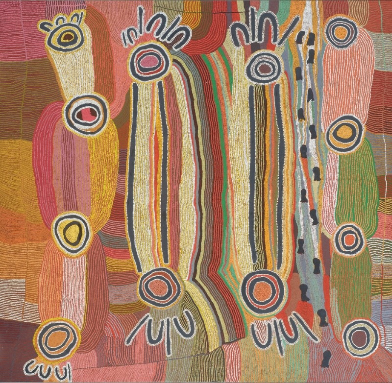 Maggie Watson Napangardi painting with two large elongated digging-stick forms, concentric circles and smaller ceremonial motifs surrounded by flowing fields of red, yellow, green, pink, orange and black lines.